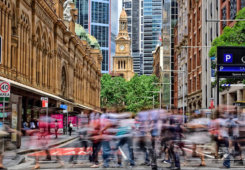 People crowd crossing street in central Sydney